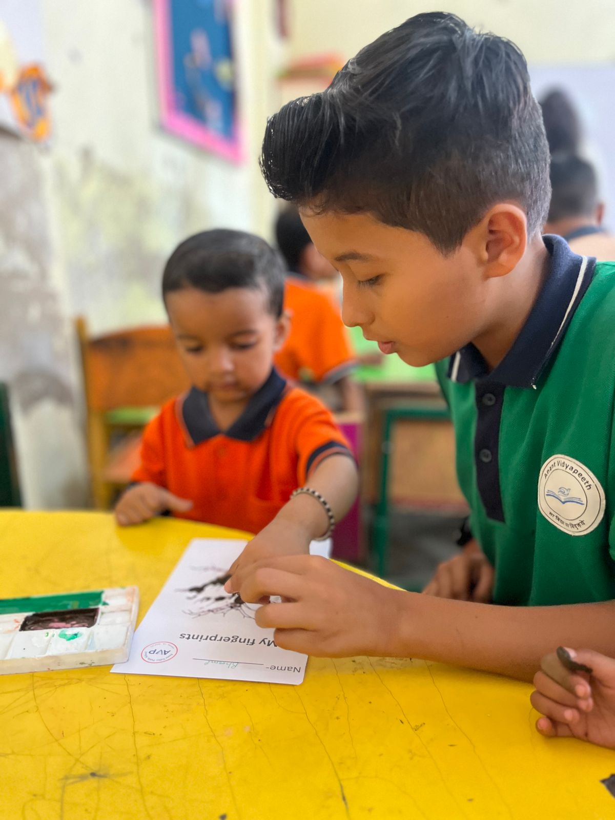 AVP school children reading books with teacher